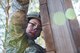 Master Sgt. Kay Williams, 919th Special Operations Security Forces Squadron takes on the climbing wall obstacle at a course May 5, 2018 on Eglin Air Force Base, Fla