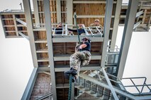 Staff Sgt. Jovani Santos Hernandez, a 919th Special Operations Security Forces Squadron training cadre member, demonstrates proper techniques for fast roping from a tower May 5, 2018 on Eglin Air Force Base, Fla.