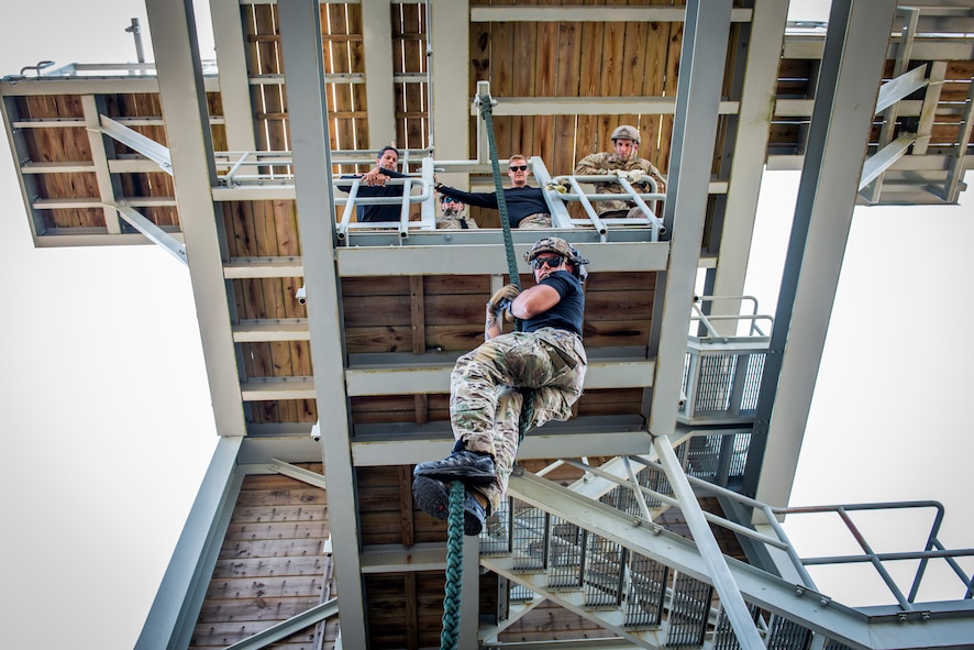 Staff Sgt. Jovani Santos Hernandez, a 919th Special Operations Security Forces Squadron training cadre member, demonstrates proper techniques for fast roping from a tower May 5, 2018 on Eglin Air Force Base, Fla.