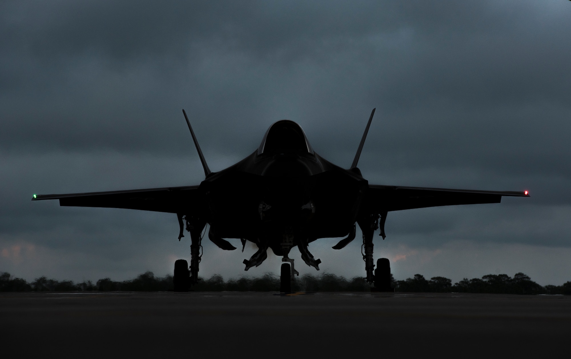 An F-35A Lightning II awaits permission to taxi May 30, 2018, at Eglin Air Force Base, Fla. The 33 FW conducted F-35A night flying operations May 29-31, 2018, satisfying a training requirement for student pilots who will routinely fly day and night operations upon entering the combat Air Force. During this iteration of the pilot training syllabus, the night flying portion was stretched later into evening hours than in the past, allowing for more qualifications to be checked off across fewer days. (U.S. Air Force photo by Airman 1st Class Emily Smallwood)