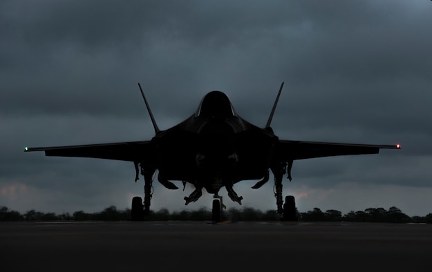 An F-35A Lightning II awaits permission to taxi May 30, 2018, at Eglin Air Force Base, Fla. The 33 FW conducted F-35A night flying operations May 29-31, 2018, satisfying a training requirement for student pilots who will routinely fly day and night operations upon entering the combat Air Force. During this iteration of the pilot training syllabus, the night flying portion was stretched later into evening hours than in the past, allowing for more qualifications to be checked off across fewer days. (U.S. Air Force photo by Airman 1st Class Emily Smallwood)