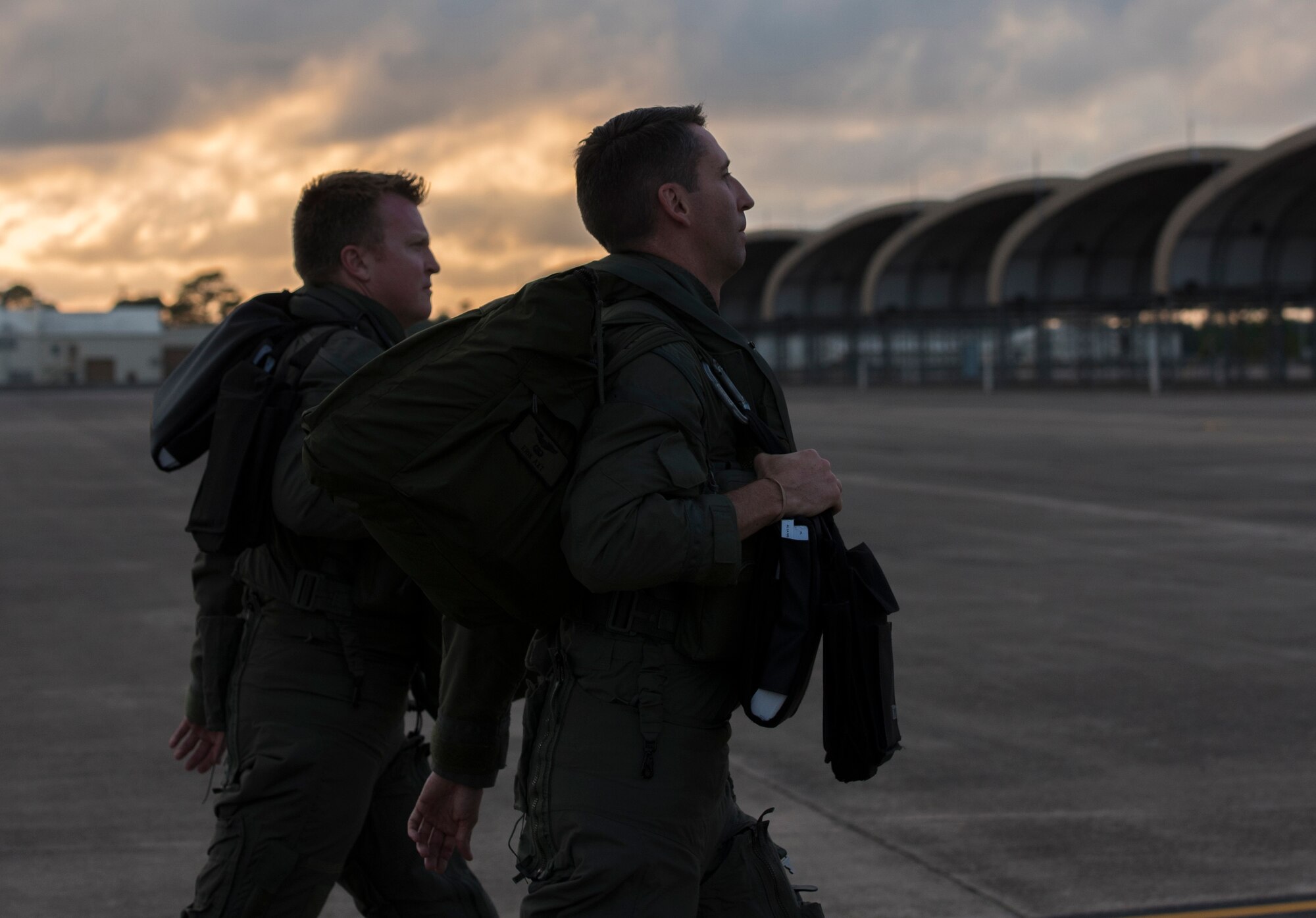 U.S. Air Force Lt. Col. Erik Axt, 33rd Fighter Wing director of staff, right, and Major James Russell, 466th Fighter Squadron chief of training, left, walk toward an F-35A Lightning II May 30, 2018, at Eglin Air Force Base, Fla. The 33 FW conducted F-35A night flying operations May 29-31, 2018, satisfying a training requirement for student pilots who will routinely fly day and night operations upon entering the combat Air Force. During this iteration of the pilot training syllabus, the night flying portion was stretched later into evening hours than in the past, allowing for more qualifications to be checked off across fewer days. (U.S. Air Force photo by Airman 1st Class Emily Smallwood)