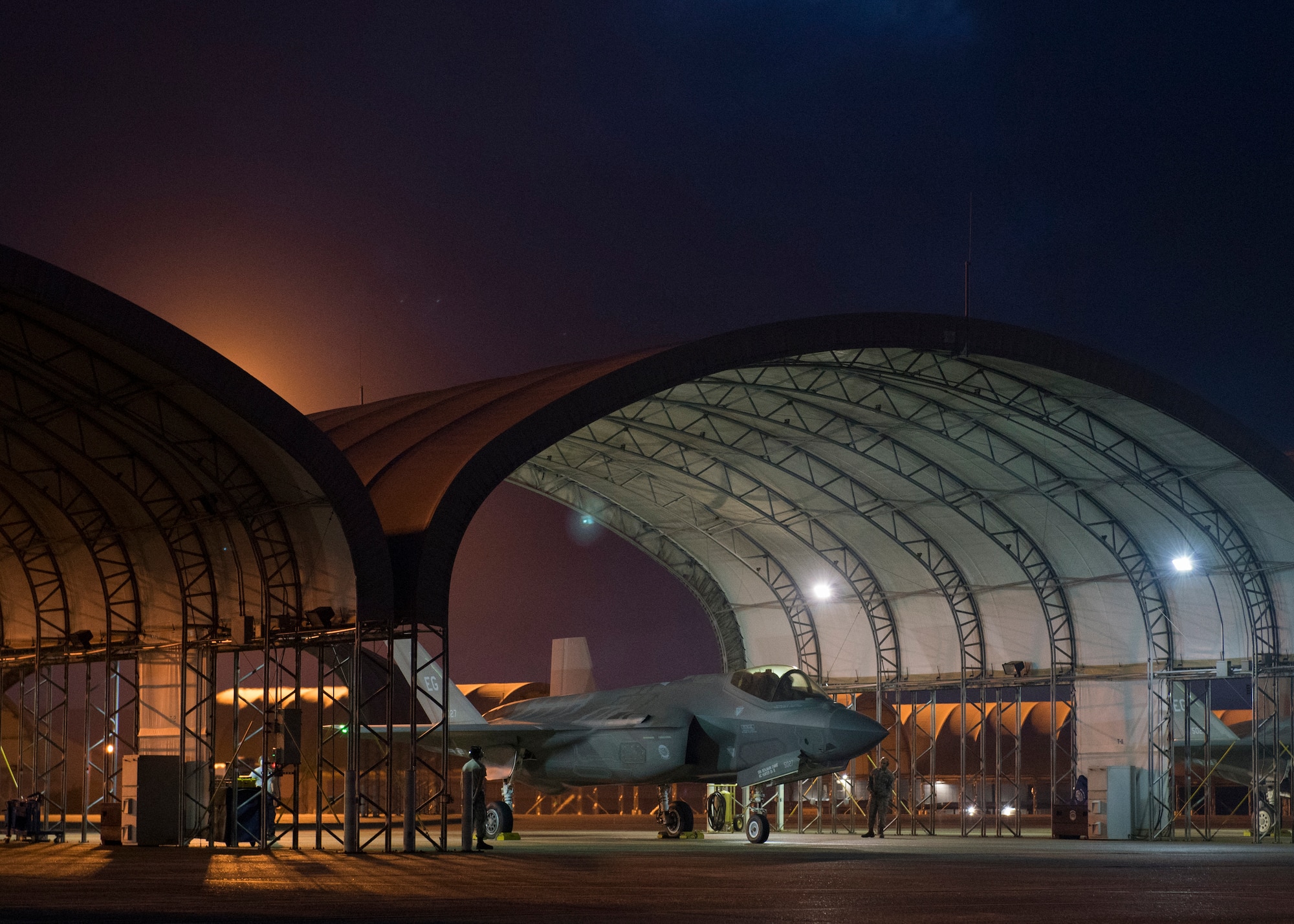 An F-35A Lightning II assigned to the 33rd Fighter Wing awaits permission to taxi May 30, 2018, at Eglin Air Force Base, Fla. The 33 FW conducted F-35A night flying operations May 29-31, 2018, satisfying a training requirement for student pilots who will routinely fly day and night operations upon entering the combat Air Force. During this iteration of the pilot training syllabus, the night flying portion was stretched later into evening hours than in the past, allowing for more qualifications to be checked off across fewer days. (U.S. Air Force photo by Staff Sgt. Peter Thompson)