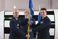 Col. Steven Lang, commander of the 45th Launch Group presents Lt. Col. Waylon Mitchell, commander of the 45th Launch Support Squadron and the 5th Space Launch Squadron, with the 45th LCSS guidon May 31, 2018 at Cape Canaveral Air Force Station, Fla. Mitchell assumed command from Lt. Col. Kathryn Cantu, and took on the role of dual-hatted commander. (U.S. Air Force photo by Airman 1st Class Zoe Thacker)