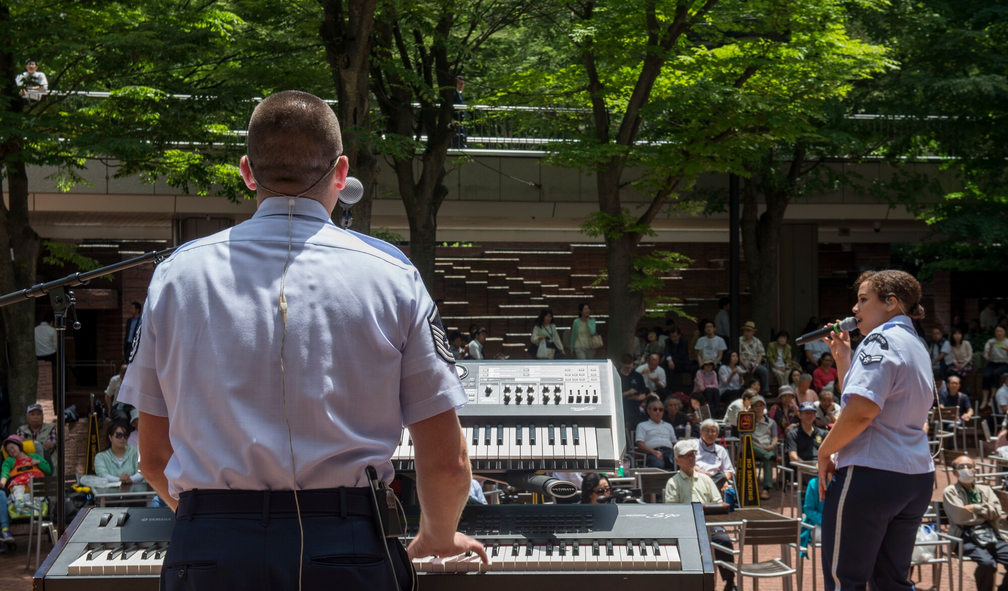 MSgt. Matthew Peacock, U.S. Air Force Band of the Pacific - Asia ensemble Final Approach pianist, and Airman 1st Class Christina Bagley, Final Approach vocalist, perform