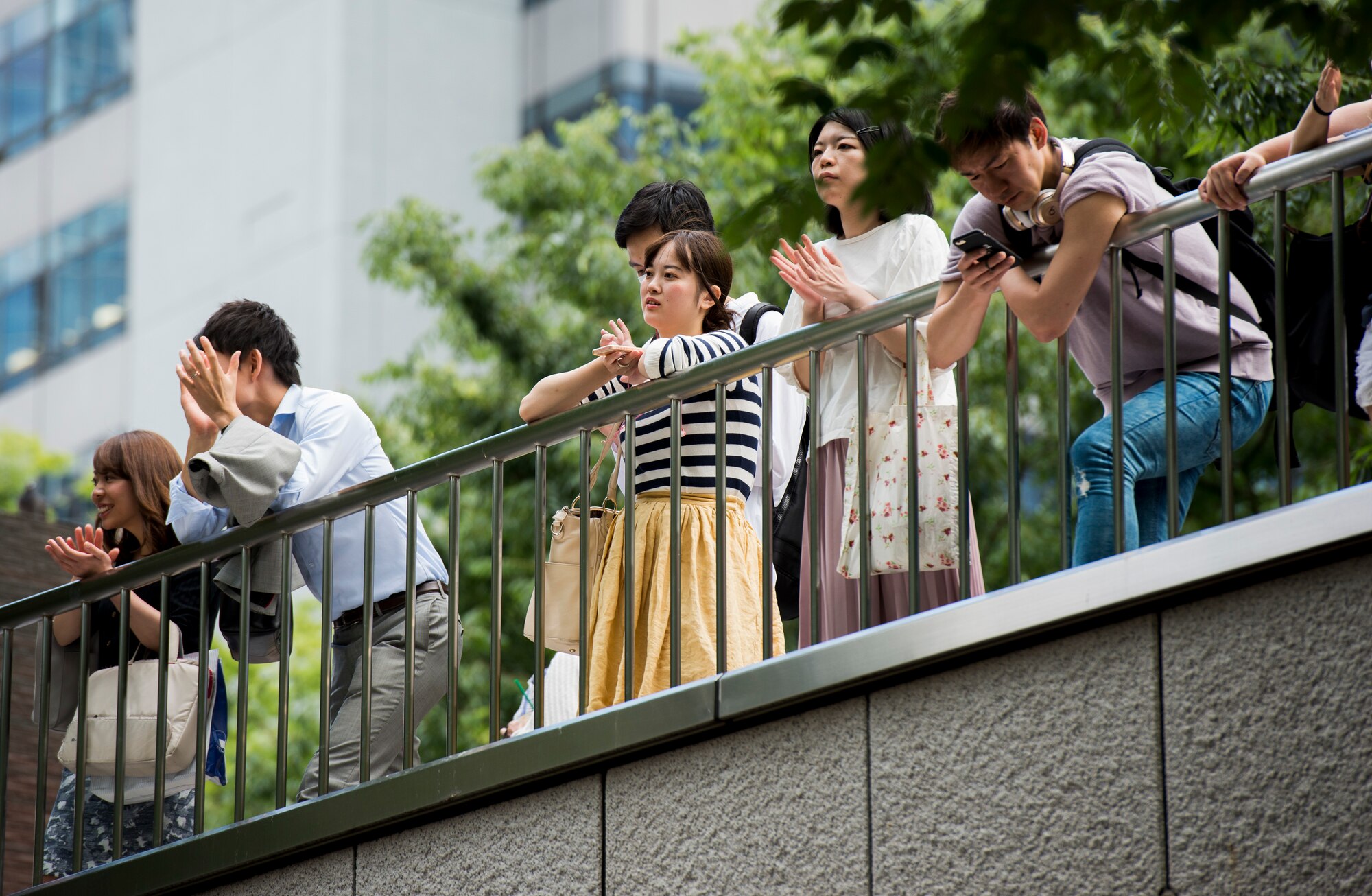 Audience members applaud the U.S Air Force Band of the Pacific-Asia ensemble Final Approach, during a lunchtime concert
