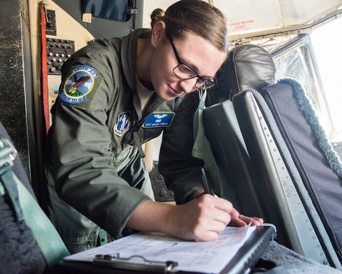 Staff Sgt. Megan Corker, an Airman assigned to the 130th Airlift Wing in West Virginia, records take-off and landing data after her final checkride May 16, 2018, at Little Rock Air Force Base, Ark. Corker performed exceptionally as a student in the 189th Airlift Wing's flight engineer course, graduating ahead of her peers. (U.S. Air National Guard photo by Tech. Sgt. Jessica Condit)