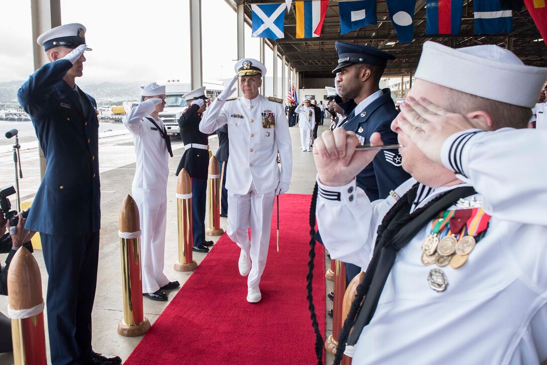Adm. Phil Davidson, commander of U.S. Indo-Pacific Command, is saluted during a change-of-command ceremony.