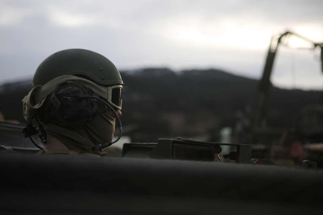 A U.S Marine tanker sits in M1A1 Abrams main battle tank during the Exercise Trident Juncture 18 joint-capability demonstration near Byneset, Norway, Oct. 30, 2018. Trident Juncture, a NATO-led exercise, hosted by Norway, will include  around 50,000 personnel from all 29 NATO  countries, as well as Finland and Sweden, and will test NATO’s collective response to an armed attack against one Ally, invoking Article 5 of the North Atlantic Treaty.