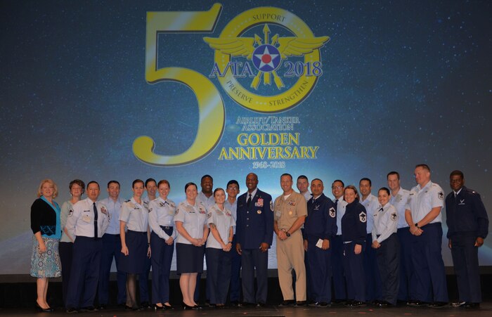 Members of Joint Base Charleston pose for a picture with Chief Master Sgt. Kaleth Wright, Chief Master Sgt. of the Air Force, at the 2018 Airlift/Tanker Association and AMC Symposium held at the Gaylord Texan Resort in Grapevine, Texas Oct. 25-28, 2018. The symposium offered JB Charleston Airmen and commanders an opportunity to interact with top military leaders and ask questions about the future of the Air Force.