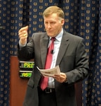 Former Walmart CEO Chris Sultemeier uses a hand gesture to make a point to DLA leaders during his presentation at the HQC McNamara Complex.