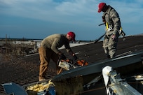 Airmen from 823rd RED HORSE Squadron at Hurlburt Field, Fla., perform structural repairs at the gas station Oct. 22 at Tyndall Air Force Base, Fla., after Hurricane Michael. Multiple major commands have mobilized relief assets in an effort to restore operations after the hurricane caused catastrophic damage to the base.