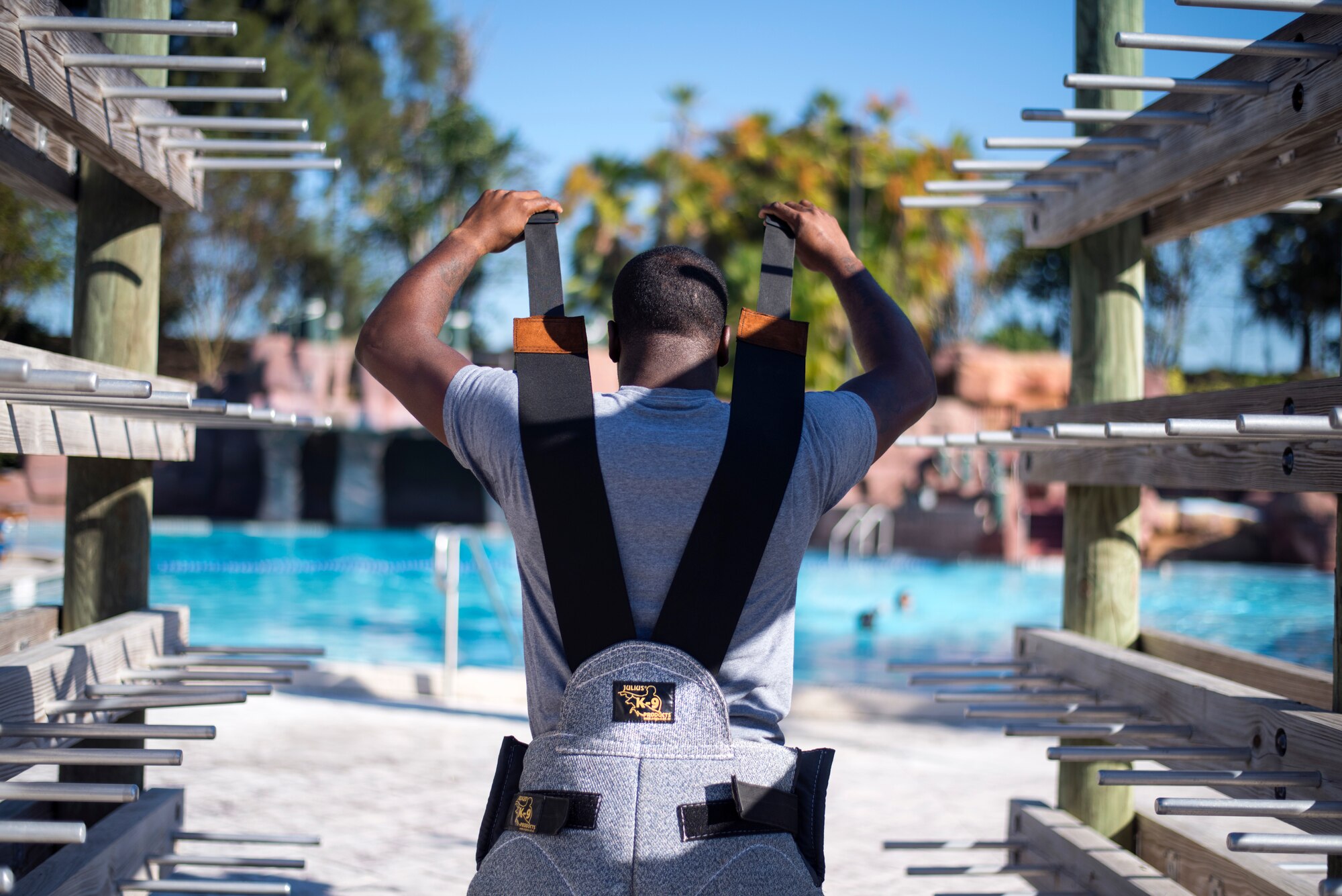 U.S. Air Force Staff Sgt. Jeffrey Greene, a military dog trainer assigned to the 6th Security Forces Squadron, puts on a K-9 protection suit at Adventure Island, Tampa, Fla. Oct. 29, 2018.