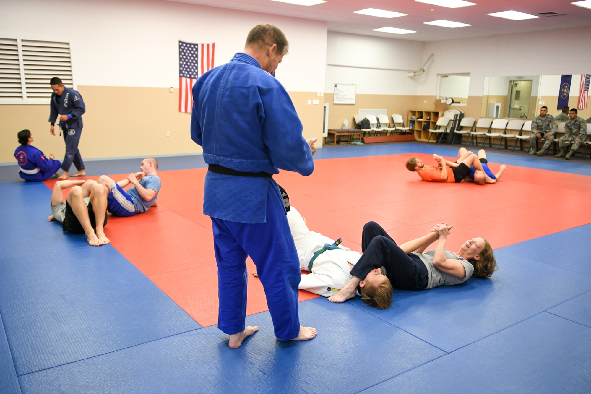 HIll Judo coach Don Chesmer guides participants with their arm-locking techniques during a free interactive training session at Hess Fitness Center on World Judo Day Oct. 30. (U.S. Air Force photo by Cynthia Griggs)