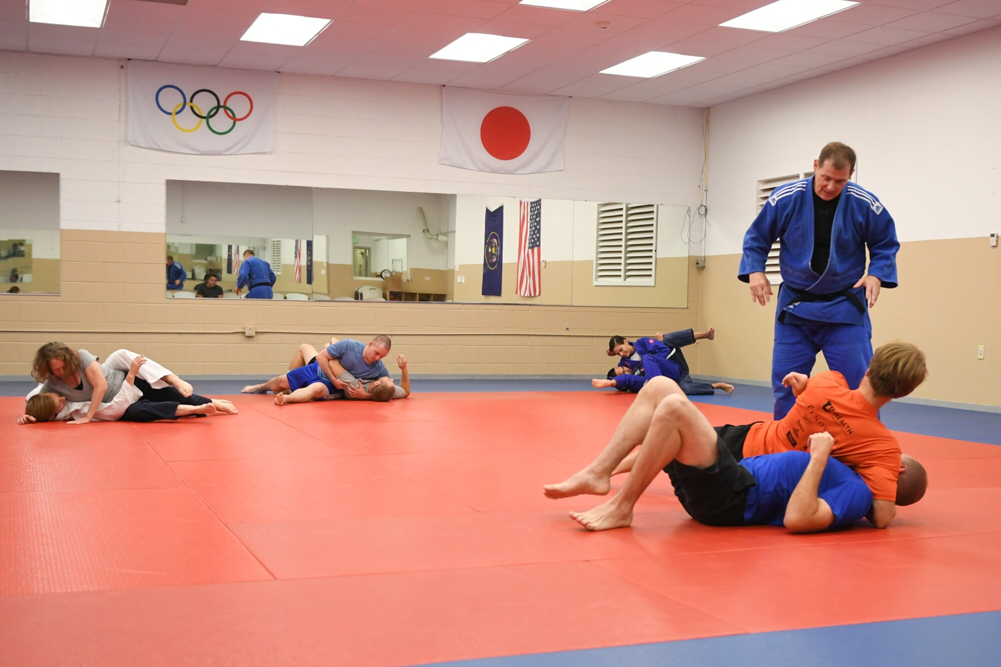 HIll Judo coach Don Chesmer guides participants with their grappling techniques during a free interactive training session at Hess Fitness Center on World Judo Day Oct. 30. (U.S. Air Force photo by Cynthia Griggs)