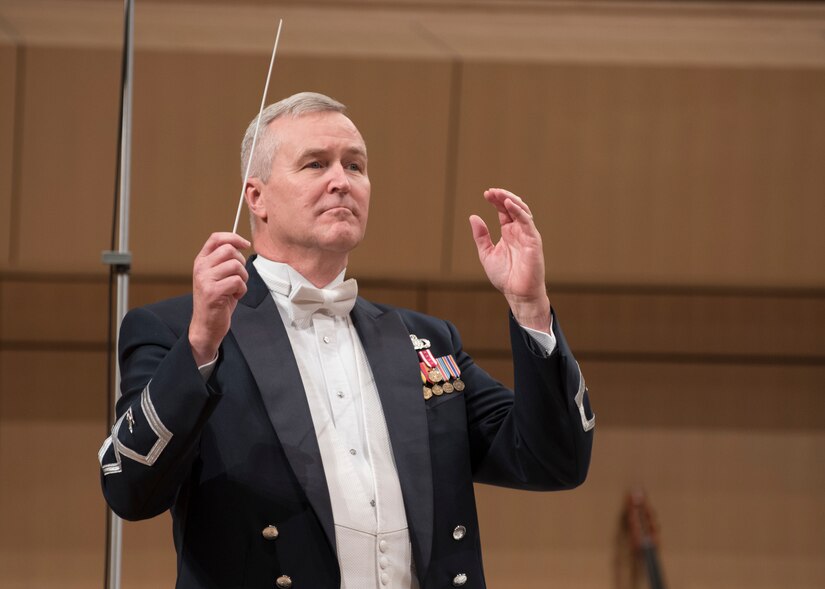 Col. Larry H. Lang, U.S. Air Force Band commander and conductor, leads the band during a performance at the V. Sue Cleveland High Concert Hall in Rio Rancho, N.M., Oct. 17, 2018. The band’s 12-day tour of New Mexico and Texas marked the last tour of Lang’s 29-year career. (U.S. Air Force photo by Senior Airman Abby L. Richardson)