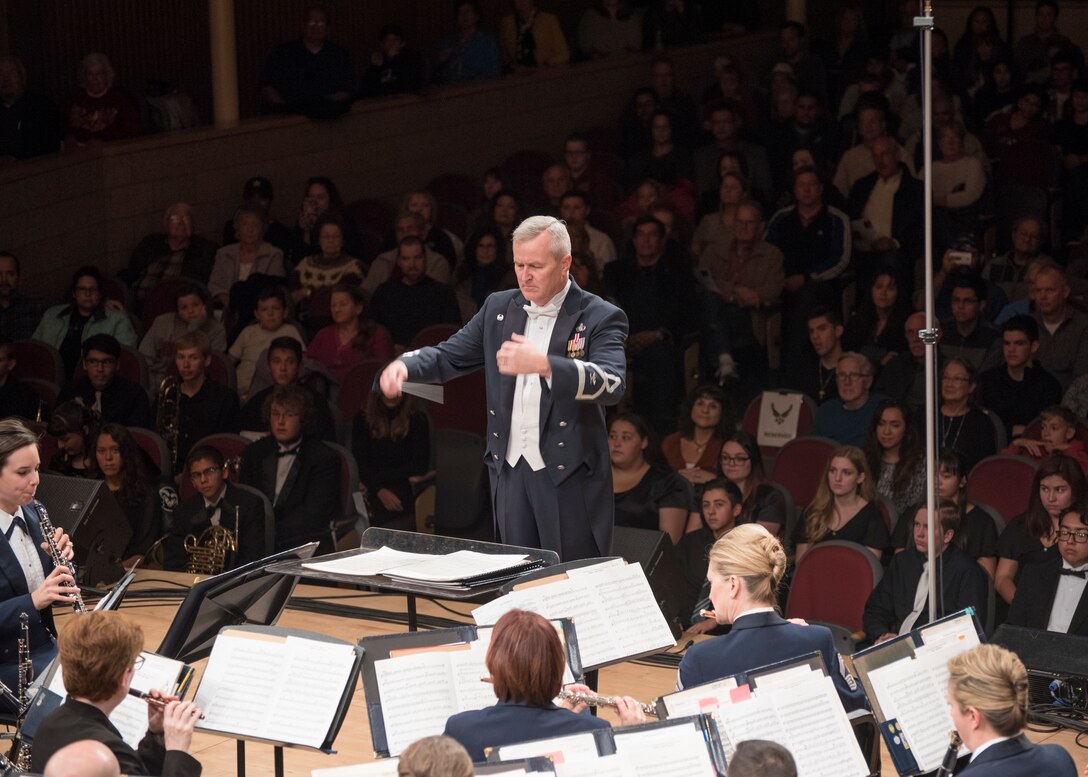 Col. Larry H. Lang, U.S. Air Force Band commander and conductor, leads the band during a performance at the V. Sue Cleveland High Concert Hall in Rio Rancho, N.M., Oct. 17, 2018. On Lang’s final trip before retirement, the band toured 12 locations in New Mexico and Texas, including Lang’s hometown of El Paso, Texas. (U.S. Air Force photo by Senior Airman Abby L. Richardson)