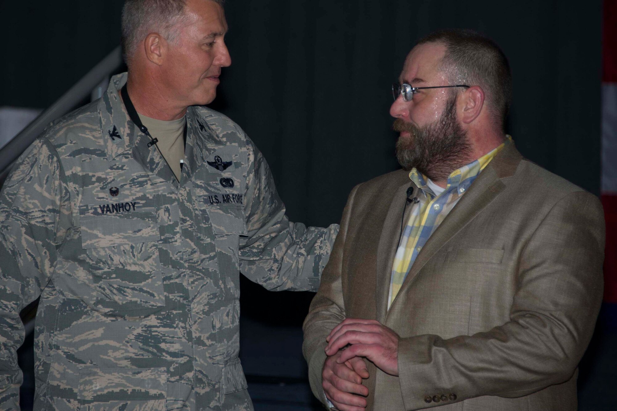 U.S. Air Force Col. Robert VanHoy, 307th Bomb Wing Commander, thanks Tom Knudsen during a Wingman Day presentation at Barksdale Air Force Base, Louisiana, Oct. 14, 2018.   Knudsen, an Air Force veteran, gave his testimony on resilience to the Citizen Reserve Airmen in attendance.  He was wounded multiple times during a tour overseas and overcame many obstacles on his road to recovery. (U.S. Air Force photo by A1C Maxwell Daigle)