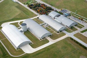 DAYTON, Ohio (10/2018) -- Aerial view of the National Museum of the U.S. Air Force. The museum collects, researches, conserves, interprets and presents the Air Force's history, heritage and traditions, as well as today's mission to fly, fight and win...in Air, Space and Cyberspace to a global audience through engaging exhibits, educational outreach, special programs, and the stewardship of the national historic collection. (U.S. Air Force photo by Ken LaRock, pilot Matt Kiefer)