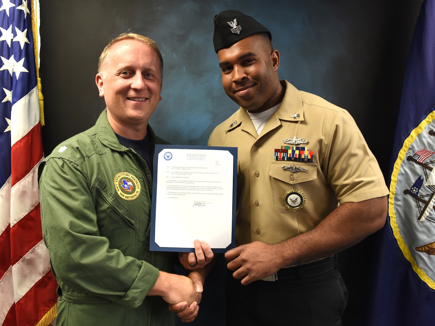 Vincent Barnes (right), assigned to Navy Recruiting Station New Braunfels, was meritoriously advanced to the rank of petty officer first class during a promotion ceremony held at Navy Recruiting District San Antonio Headquarters by Cmdr. Jeffrey Reynolds.