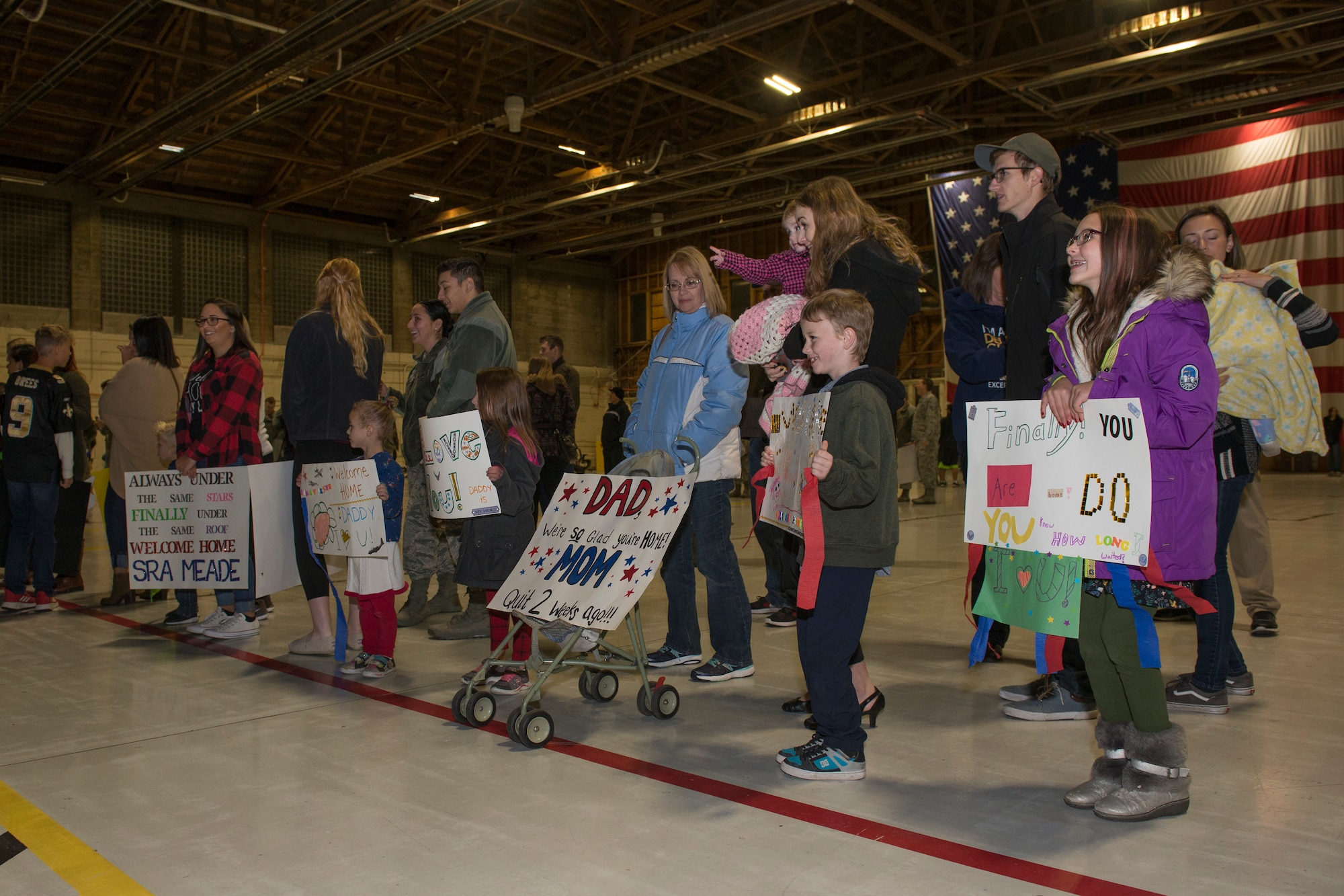 Familiy memebers await the return of the 726th Air Control Squadron Airman, Moumtain Home Air Force Base, October 27, 2018. The Airmen of the 726th ACS Airmen returned home from a six-month deployment. (U.S. Air Force photo by Senior Airman Tyrell Hall)
