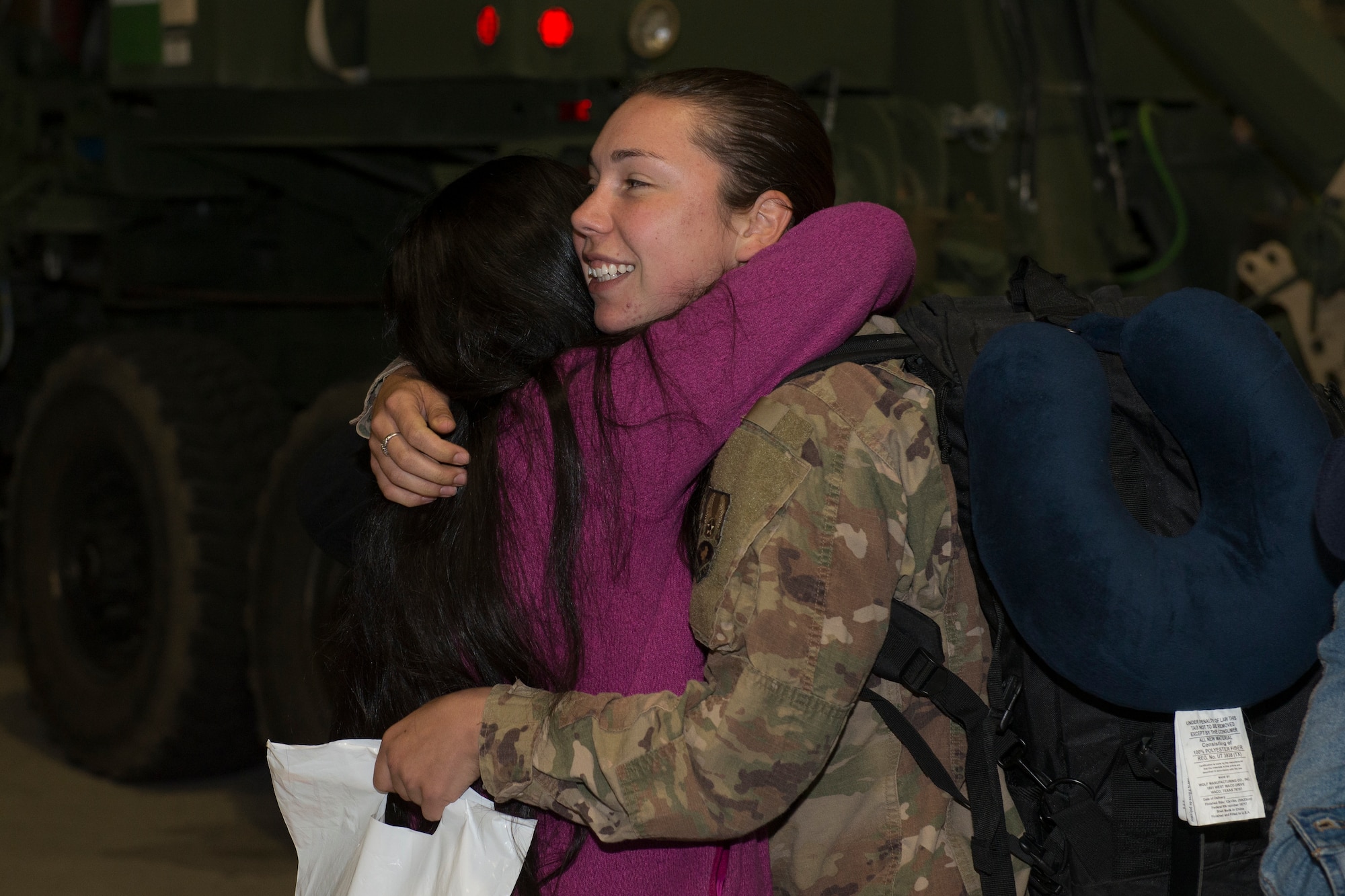 An Airman from the 726th Air Control Squadron returns from deployment and embraces her friend, October 27, 2018, at Mountain Home Air Force Base, Idaho. Over 100 Airmen from the 726th ACS deployed with mission of supporting communication between air craft and ground units. (U.S. Air Force photo by Senior Airman Tyrell Hall)