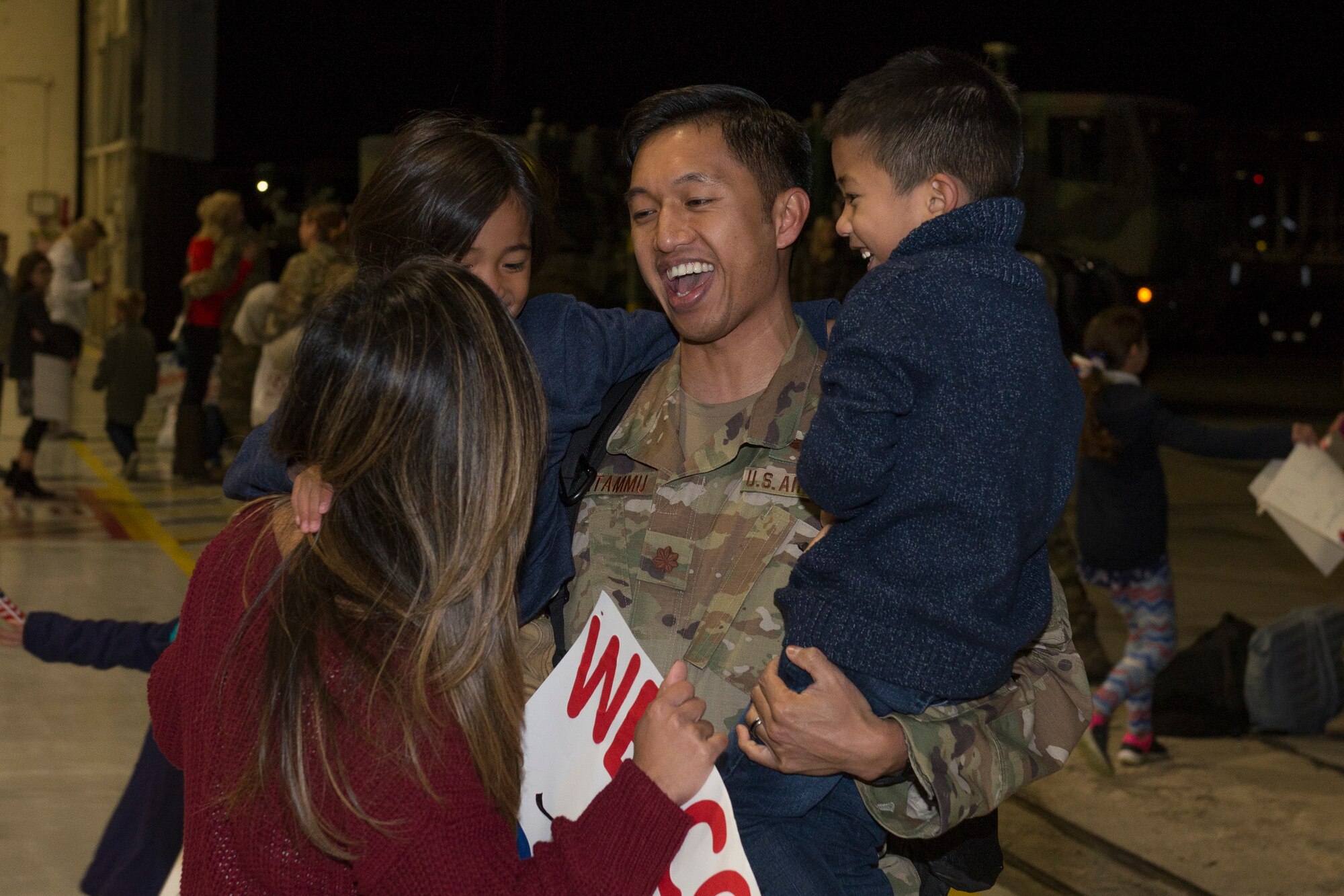 An Airman from the 726th Air Control Squadron returns from deployment and is greeted by his family, October 27, 2018, at Mountain Home Air Force Base, Idaho. 120 Airmen from the 726th ACS deployed with mission of supporting communication between air craft and ground units. (U.S. Air Force photo by Senior Airman Tyrell Hall)