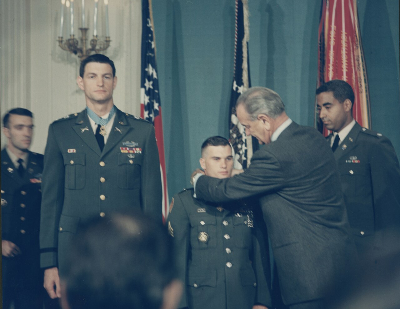 President Johnson puts Medal of Honor over Baker’s neck at ceremony.