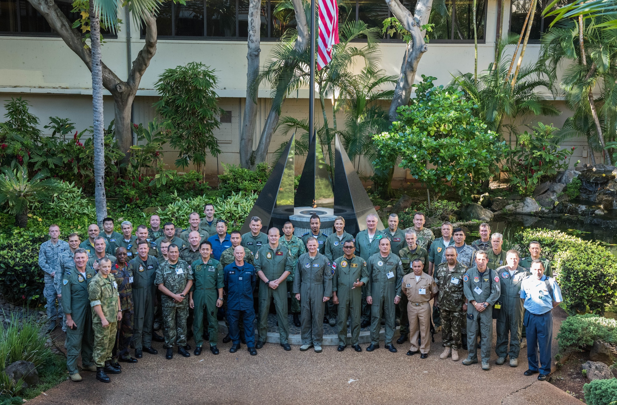 Maj. Gen. Russ Mack, Pacific Air Forces (PACAF) deputy commander, takes a photo with foreign attachés during a tour of Headquarters PACAF, Joint Base Pearl Harbor-Hickam, Hawaii, October 23, 2018.