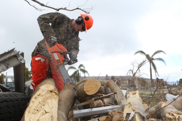 Sgt. Charles Herndon, a combat engineer with Combat Logistics Battalion 31, chainsaws a downed tree outside the Tinian Public School, Oct. 30, 2018. Herndon, a native of Carrollton, Georgia, enlisted in June 2013 after graduating from Central High School in May of the same year. Marines with the 31st Marine Expeditionary Unit and CLB-31 spent the day helping clear debris at the school as part of the U.S. Defense Support of Civil Authorities across the Commonwealth of the Northern Mariana Islands, to which Tinian belongs. The Marines arrived at the request of CNMI officials and the U.S. Federal Emergency Management Agency to assist relief efforts in the wake of Yutu, the largest typhoon to ever hit a U.S. territory. The 31st MEU, the Marine Corps’ only continuously forward-deployed MEU, provides a flexible force ready to perform a wide-range of military operations across the Indo-Pacific region. (U.S. Marine Corps photo by Gunnery Sgt. T. T. Parish/Released)