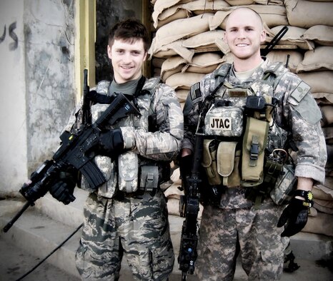 Senior Airmen Mike Malarsie and Bradley Smith pose for a photo during their Afghanistan deployment. An improvised explosive device attack mortally wounded Airman Smith and injured Airman Malarsie Jan. 3, in Afghanistan.