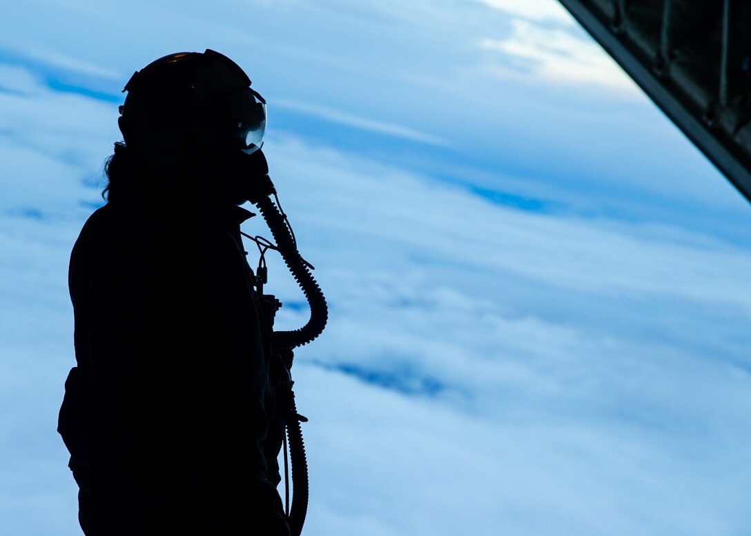 U.S. Marine Cpl. Kathryn Norton, a crewmaster, flies aboard a KC-130J Super Hercules during Exercise Trident Juncture 18 at Vaernes Air Base, Norway, Oct. 31, 2018.