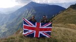New York Army National Guard 1st Lt. Christian Larrabee, right, displays the United Kingdom colors at the conclusion of his Military Exchange Program training tour with British Army 2nd Lt. Max George, assigned to the Fifth Royal Regiment of Fusiliers following the Triglav Star 2018 multinational training exercise at the NATO Multinational Centre of Excellence for Mountain Warfare in the Julian Alps of Slovenia. Larrabee served as a platoon leader during company level training lanes in the mountain warfare exercise.