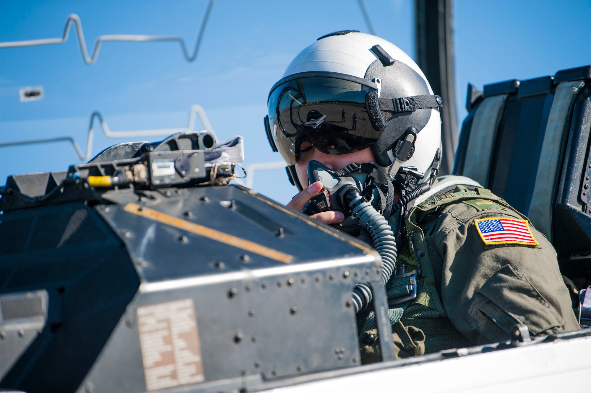U.S. Navy Ensign Quinn Nystrom, a student naval flight officer assigned to Training Squadron 86 (VT-86) from Naval Air Station Pensacola, Fla., checks his communication system before a training flight at MacDill Air Force Base, Fla., Oct. 31, 2018.