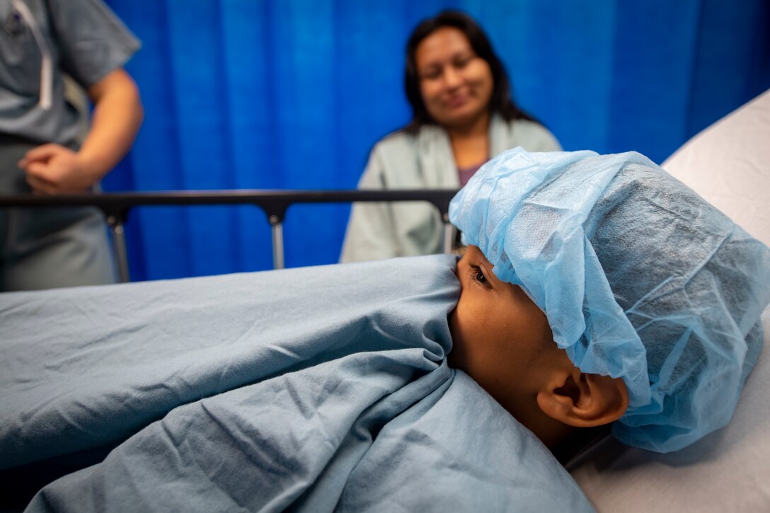 A seven-year-old patient prepares to enter surgery, to repair a cleft palate, aboard the hospital ship USNS Comfort (T-AH 20).