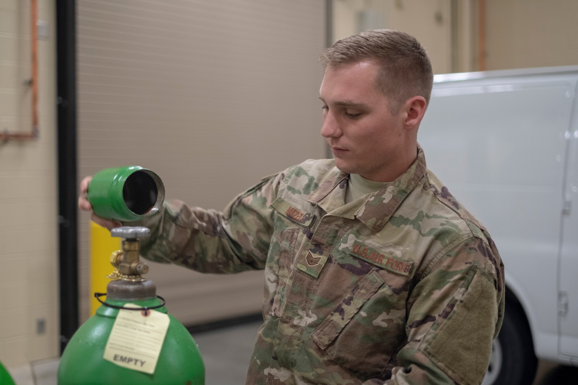Staff Sgt. James Mizell, 931st Maintenance Squadron Electrical and Environmental journeyman, places a cap on a gaseous oxygen tank Oct. 14, 2018, McConnell Air Force Base, Kan.