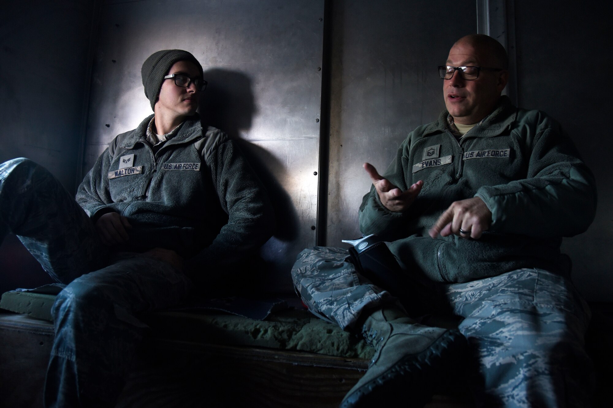 Senior Airman Kevin Walton, 22nd Aircraft Maintenance Squadron aerospace propulsion journeyman, and Master Sgt. Christopher Evans, 22nd Air Refueling Wing career assistance advisor, chat about Air Force career progression Oct. 11, 2018, at McConnell Air Force Base, Kansas. Evans created a new program where he visits Airmen around base while they perform their daily duties in order to be there to answer any career questions on the spot. (U.S. Air Force photo by Airman Michaela R. Slanchik)