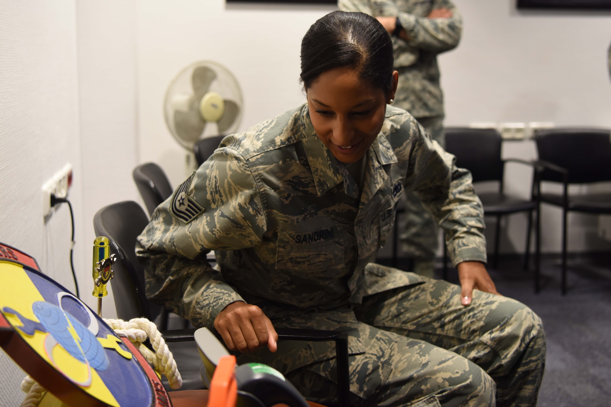Tech Sgt. Olivia Sandrini, 721st Aircraft Maintenance Squadron, command support staff and programs section chief, receives a call from Gen. Stephen W. Wilson, Vice Chief of Staff of the Air Force, on Ramstein Air Base, Germany, Nov. 1, 2018. Sandrini was selected to attend officer’s training school via the Senior Leader Enlisted Commission Program.