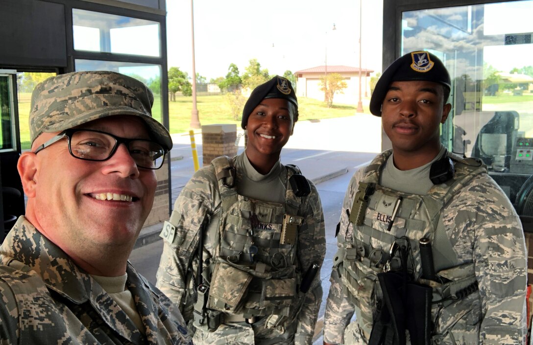 Master Sgt. Christopher Evans, 22nd Air Refueling Wing career assistance advisor, visits with members of the 22nd Security Forces Squadron at McConnell Air Force Base, Kansas. CAAs assist commanders and supervisors in career planning, progression and provide interpretations of applicable policies and programs. (Courtesy photo)