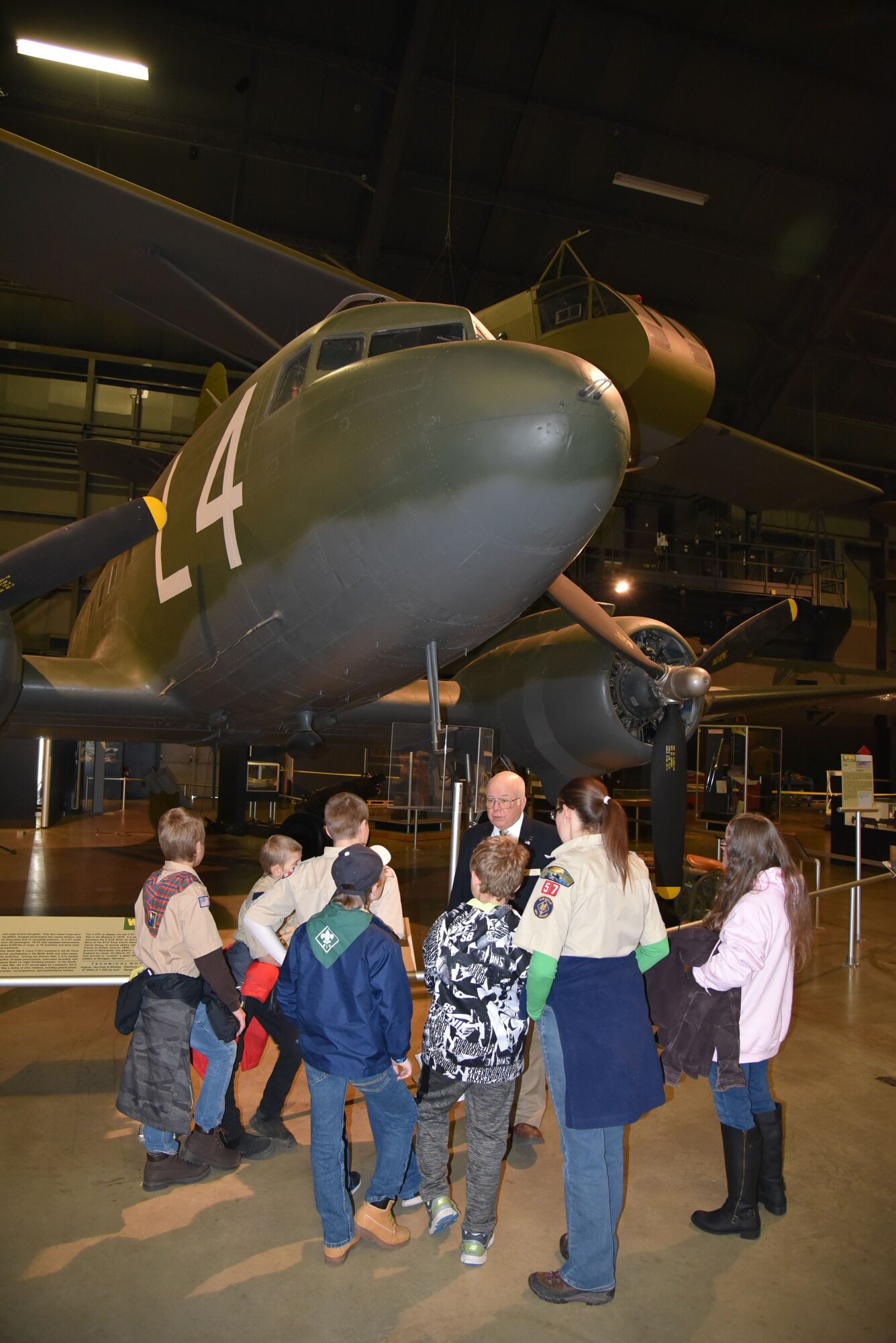 The National Museum of the U.S. Air Force commemorates Veterans Day with a "Plane Talks" program where visitors have the chance to interact with veterans and subject matter experts. Here, from last year’s Veterans Day Plane Talks, Major (Ret.) Jack Kuntz speaks with visitors about his C-47 piloting experience. (U.S. Air Force photo by Ken LaRock)