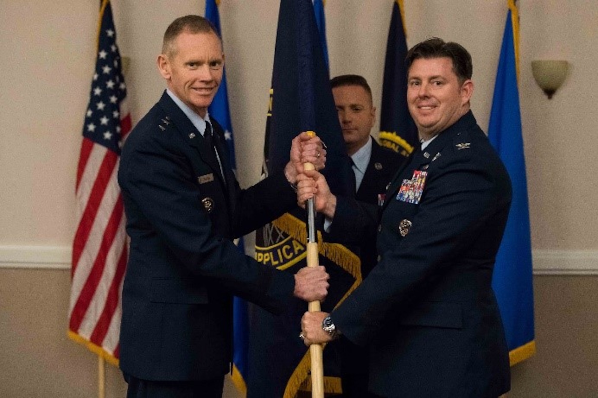 U.S. Air Force Lt. Col. David H. Donatelli II, outgoing 608th Strategic Operations Squadron commander, relinquishes command to Maj. Gen. James Dawkins Jr., 8th Air Force and J-GSOC commander, during a deactivation ceremony at Barksdale Air Force Base, La., Oct. 15, 2018. The 608th STOS has supported joint operations since June 4, 2004. (U.S. Air Force photo by Airman 1st Class Tessa Corrick)