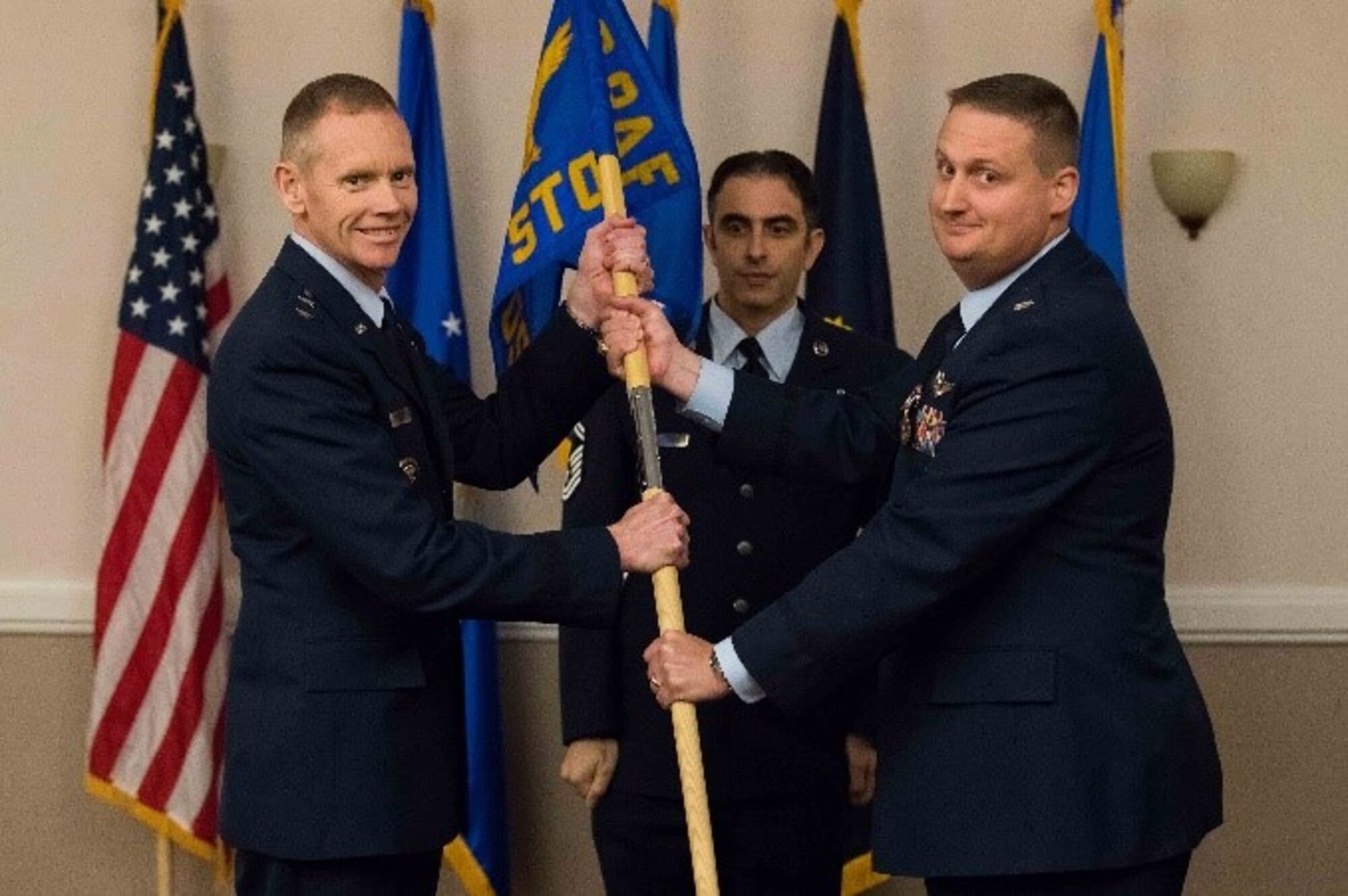 U.S. Air Force Lt. Col. David H. Donatelli II, outgoing 608th Strategic Operations Squadron commander, relinquishes command to Maj. Gen. James Dawkins Jr., 8th Air Force and J-GSOC commander, during a deactivation ceremony at Barksdale Air Force Base, La., Oct. 15, 2018. The 608th STOS has supported joint operations since June 4, 2004. (U.S. Air Force photo by Airman 1st Class Tessa Corrick)