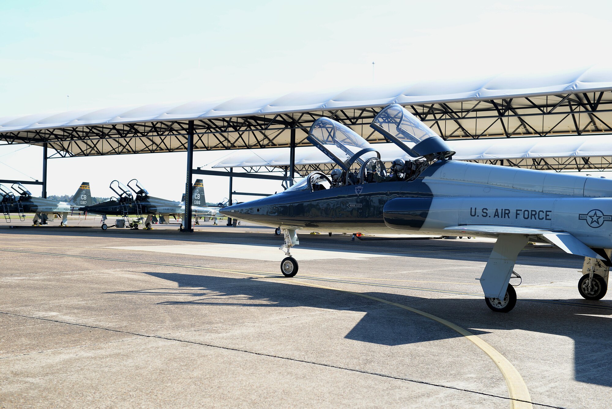 First Lt. Tyler Hansen, 49th Fighter Training Squadron student pilot, and Capt. Cole Stegeman, 49th FTS upgrading instructor pilot, move to the runway to begin flight for a training sortie Oct. 30, 2018, on Columbus Air Force Base, Mississippi. The 49th FTS holds a high standard to ensure the pilots that leave the squadron are highly capable of working well with a team and able to adjust accordingly when needed (U.S. Air Force photo by Airman Hannah Bean)