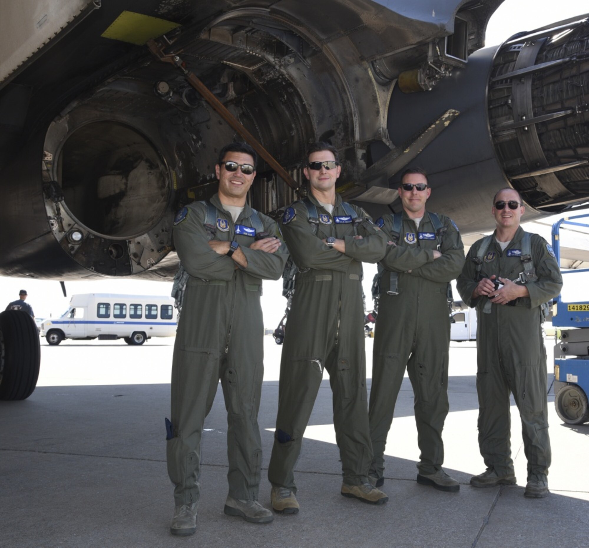10th Flight Test Squadron flight crew for B-1B Lancer, 86-0109, pose for a group photo where the #3 engine has been removed after ferrying the aircraft from Midland International Air & Space Port to Tinker Air Force Base, Oklahoma, on Oct. 26, 2018. Shown are: Maj. Ivan Vian; pilot and aircraft commander, Maj. Michael Griffin; copilot, Lt. Col. James Couch; Offensive Weapons System Officer and Lt. Col. Matthew Grimes; Defensive Weapons System Officer. The damaged B-1B will undergo depot-level maintenance and upgrades with the Oklahoma City Air Logistics Complex. During a routine training flight May 1, the Dyess AFB based B-1B had an in-flight emergency resulting in an attempted ejection. The first crewmembers’ seat failed to deploy and the aircraft commander halted the ejection sequence and heroically saved the aircraft and crew by landing at Midland International Air & Space Port.