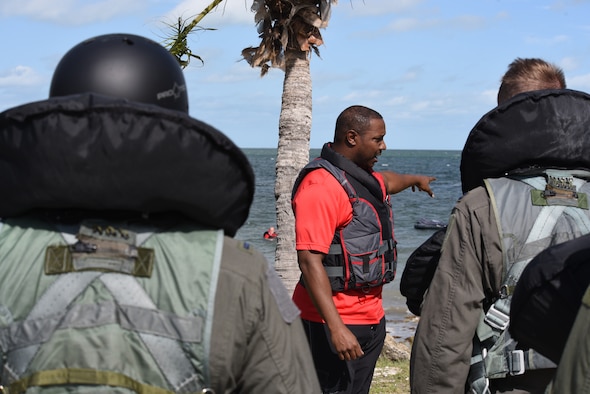 Tech. Sgt. Charles Johnson, 301st Operations Support Flight Aircrew Flight Equipment technician, prepares pilots for water survival training, Oct. 28, 2018, at Naval Air Station Key West, Florida. The pilots, who are required to go through the course every three years, learn how to escape parachute entanglements and survive in a one-man raft in case of emergency, which helps them stay combat and deployment ready. (U.S. Air Force photo by Tech. Sgt. Charles Taylor)