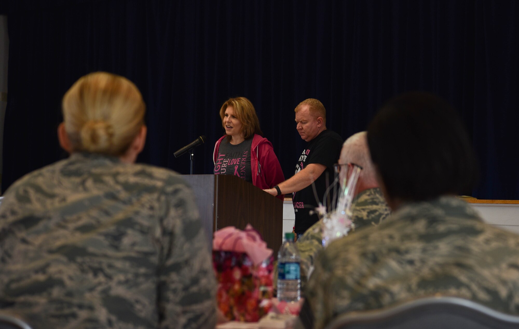 Shelia Coffey, a recent survivor of breast cancer, stands and speaks to a group of people about the hardships of breast cancer and her experience with the disease, Oct. 24, 2018, on F.E. Warren Air Force Base, Wyo.  After skin cancer, breast cancer is the most common form of cancer in women. (U.S. Air Force photo by Airman 1st Class Braydon Williams)