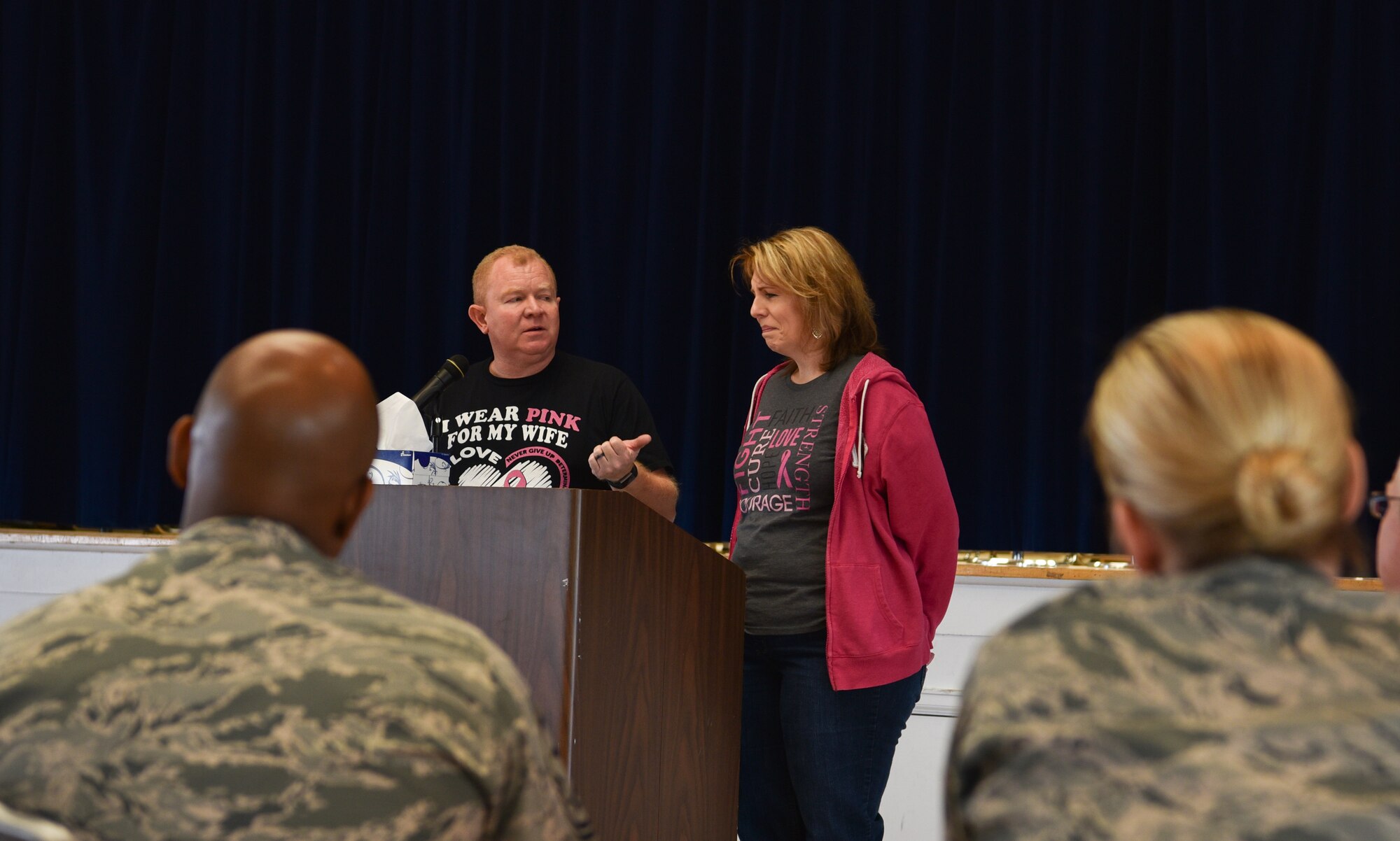 John Coffey, 90th Civil Engineer Squadron carpenter, stands and speaks to a group of people about the hardships of breast cancer on a family, Oct. 24, 2018, on F.E. Warren Air Force Base, Wyo. After skin cancer, breast cancer is the most common form of cancer in women. (U.S. Air Force photo by Airman 1st Class Braydon Williams)
