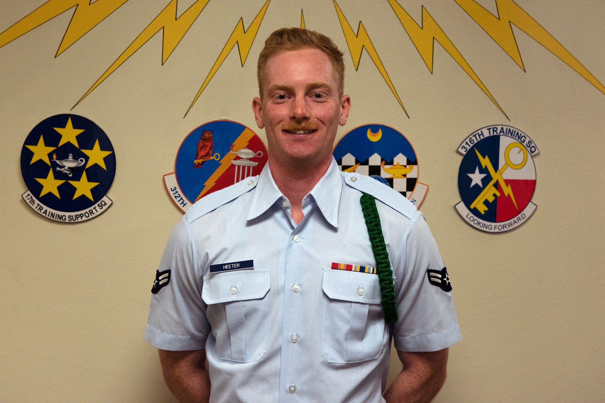 U.S. Air Force Airman 1st Class Dylan Heeter, 315th Training Squadron student, poses after receiving his Student of the Month award at Brandenburg Hall on Goodfellow Air Force Base, Texas, Nov. 2, 2018. Dylan is the Goodfellow Student of the Month spotlight for October 2018, a series highlighting Goodfellow students. (U.S. Air Force photo by Airman 1st Class Zachary Chapman/Released)