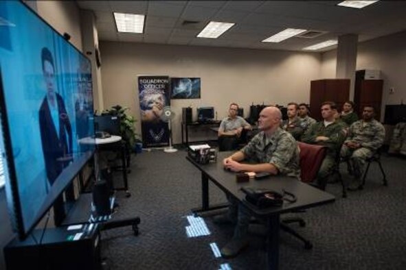 A Squadron Officer School student interacts with an avatar as part of the Mixed Reality Learning Experience program Oct. 18, 2018, Maxwell Air Force Base, Alabama. The scenario involved a dispute between two colleagues, in which the student had to intervene and help the two come to an agreement. (U.S. Air Force photo by Senior Airman Alexa Culbert)