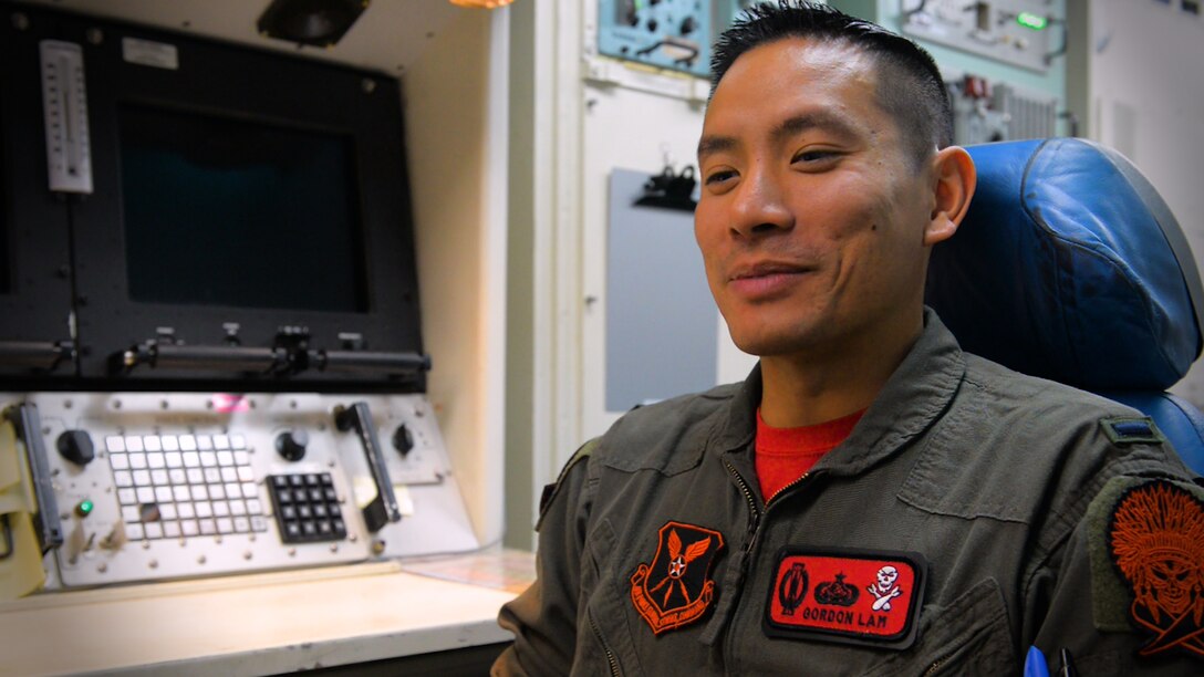 An Air Force missileer sits in front of a launch control center console.